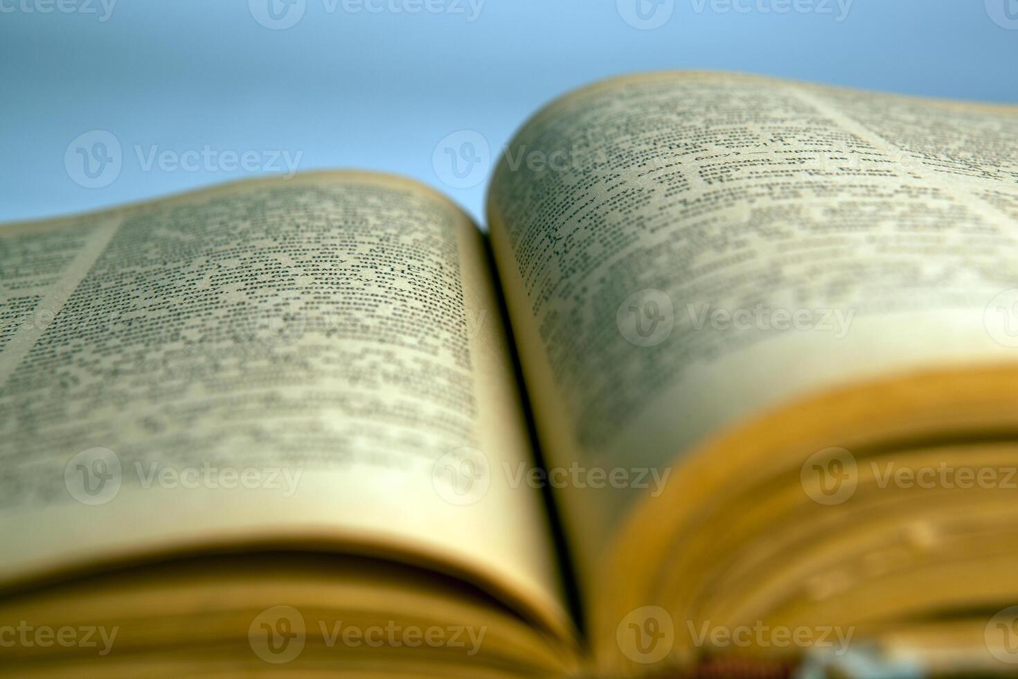 Open old book text close-up photo
