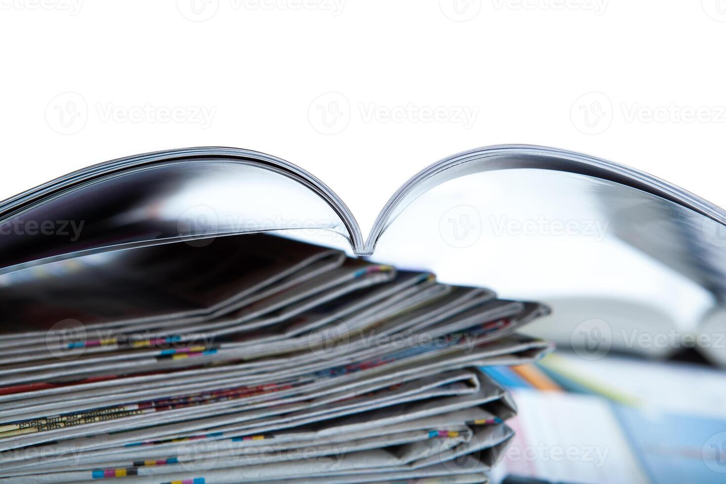 stack of newspapers, magazine, and keyboard close-up photo