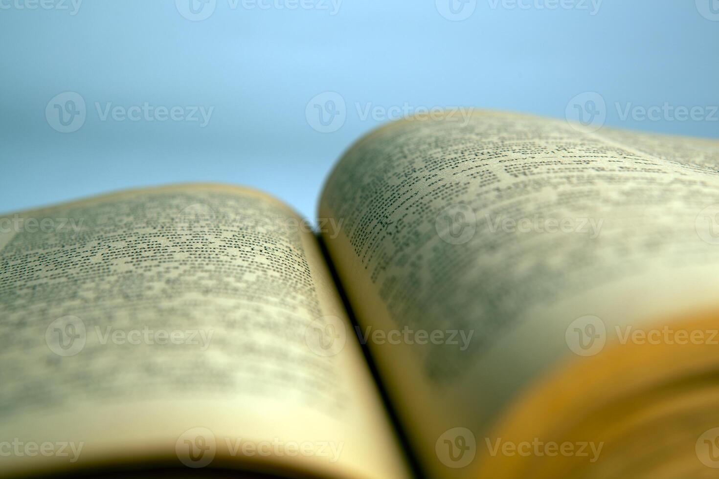 Open old book text close-up photo