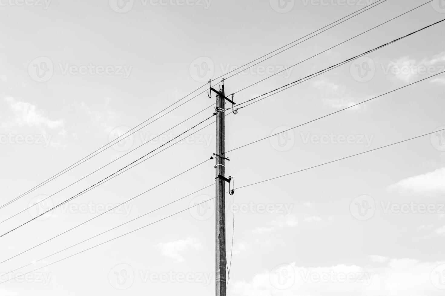 Power electric pole with line wire on dark background close up photo