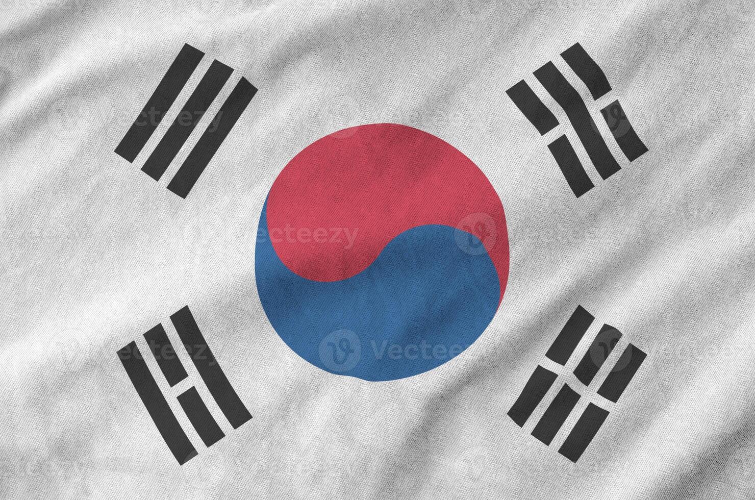 South Korea flag depicted on folded wavy fabric of old cloth photo