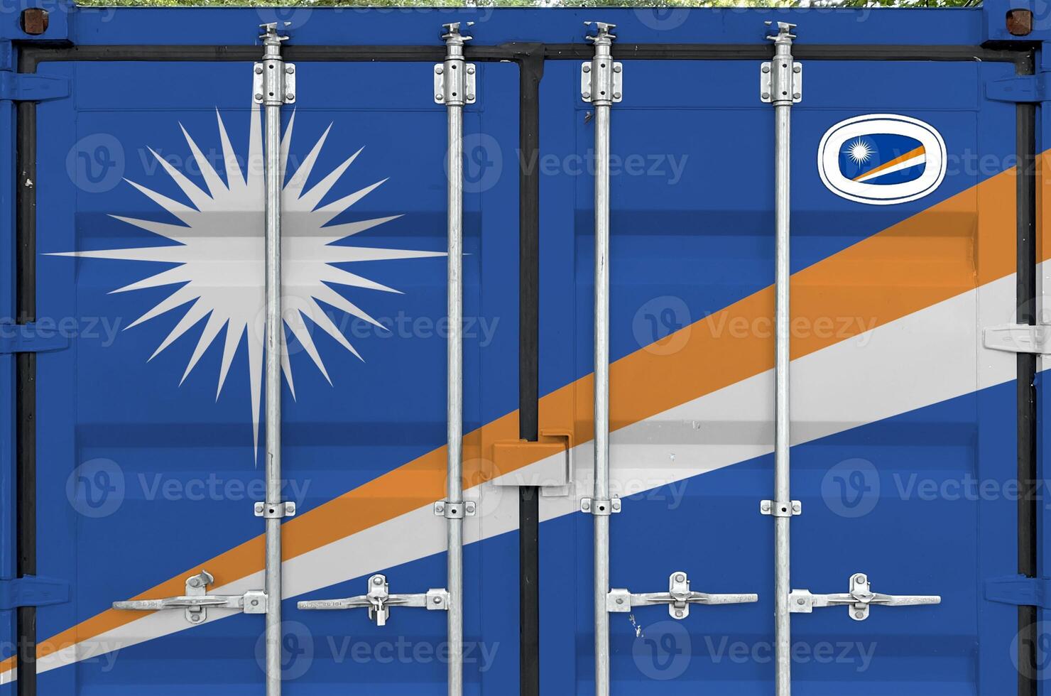 Marshall Islands flag depicted on metal doors of shipping cargo container outdoors in docks area photo