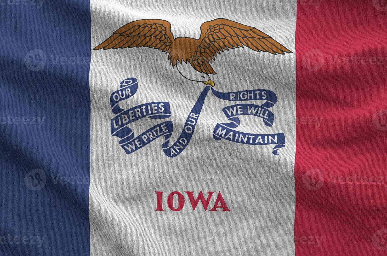 Iowa US state flag depicted on folded wavy fabric of old cloth photo
