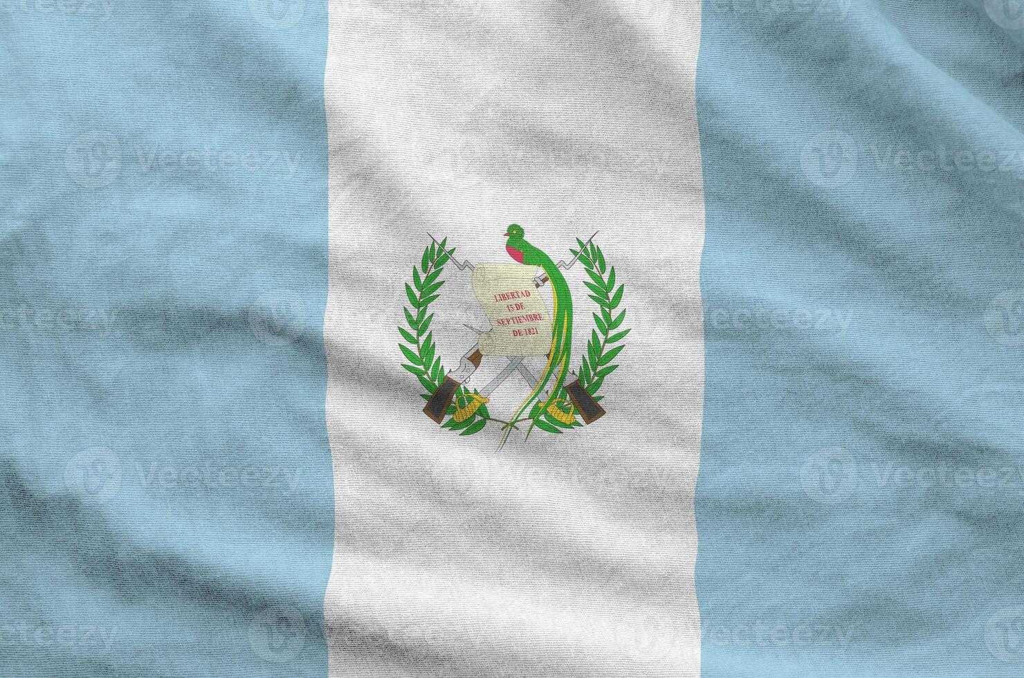 Guatemala flag depicted on folded wavy fabric of old cloth photo