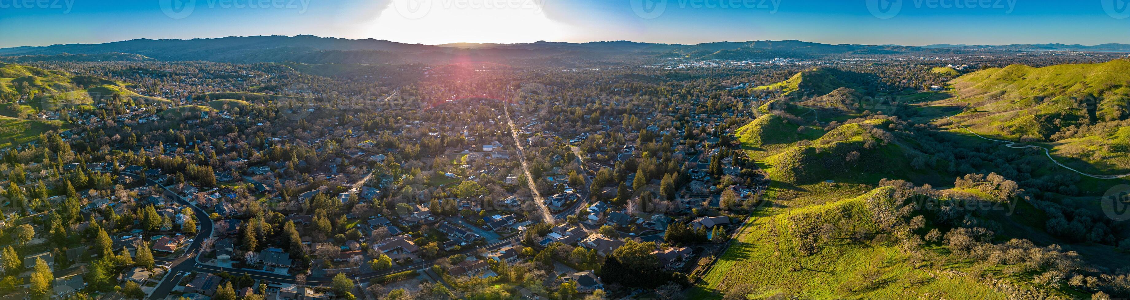 Wallnut Creek Aerial Panorama. Suburban city and green hills at sunset photo