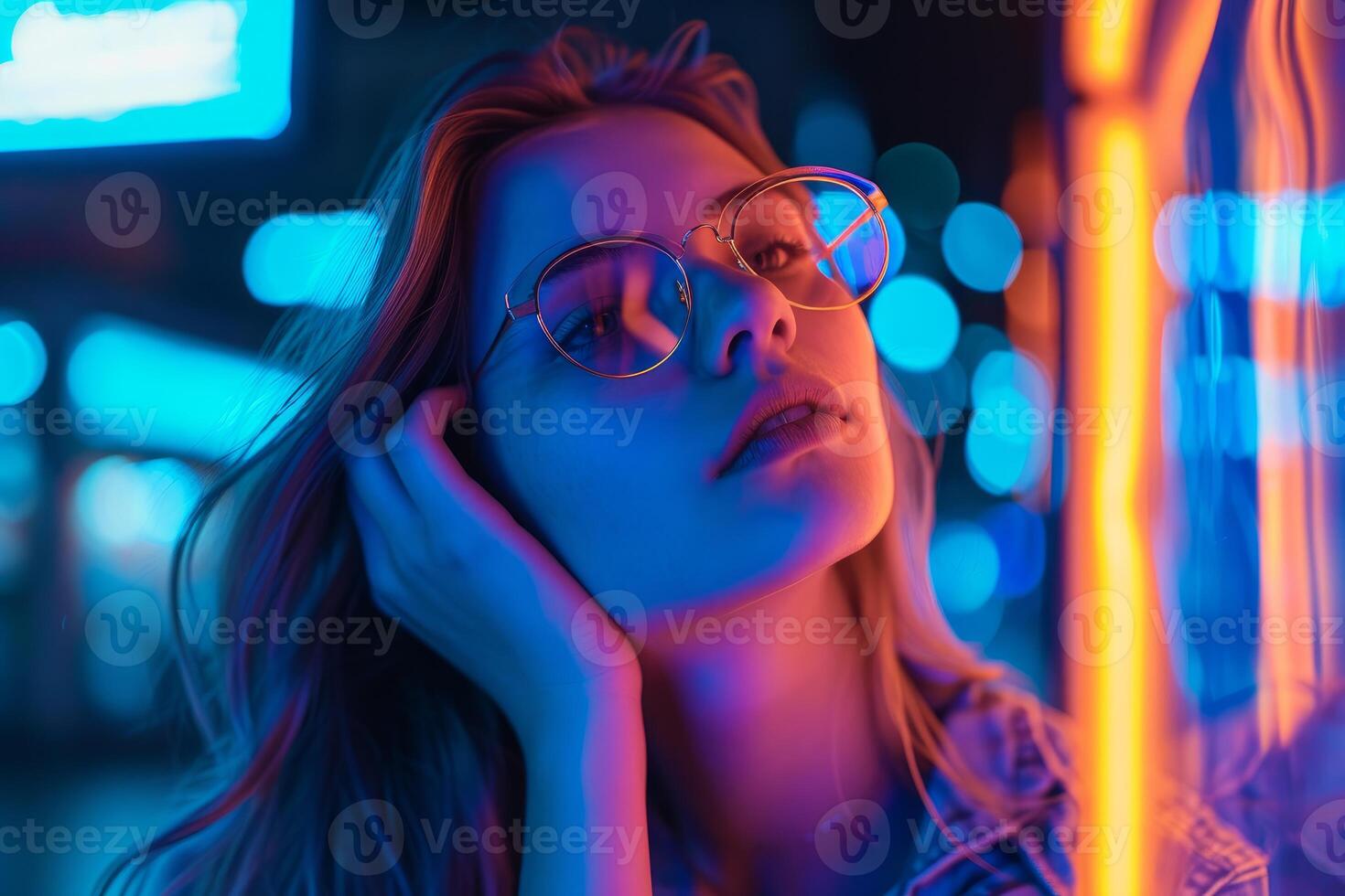 Dreamy neon glow - stylish woman with glasses photo