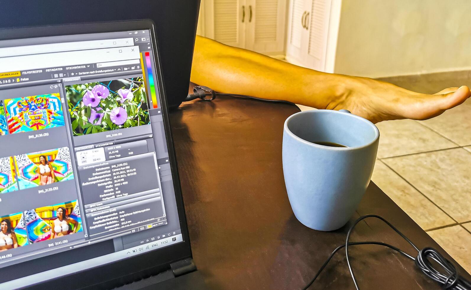 Playa del Carmen Quintana Roo Mexico 2021 Laptop work at table with coffee cup in Mexico. photo