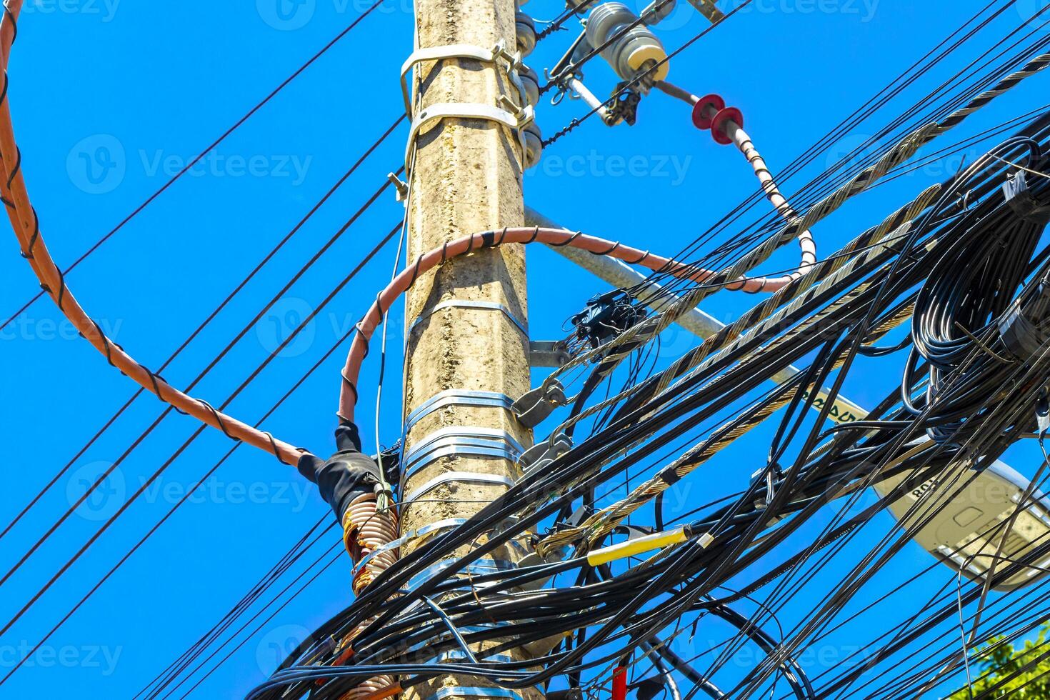 Absolute cable chaos on mexican power pole in Mexico. photo