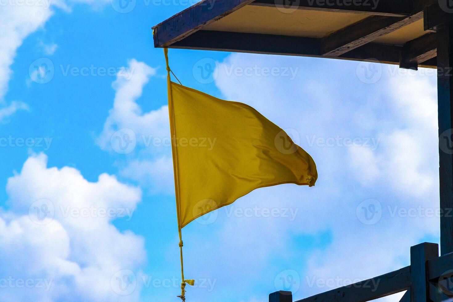 Yellow flag swimming prohibited high waves Playa del Carmen Mexico. photo