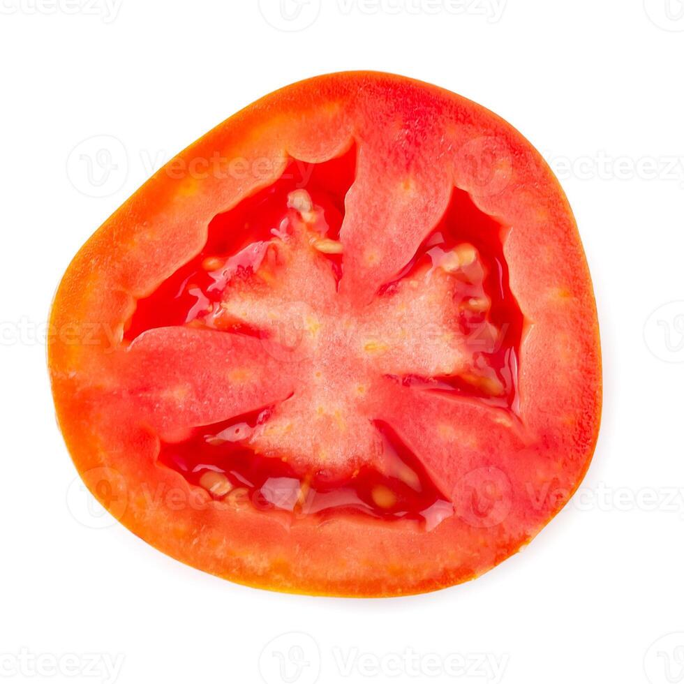 Tomato slice isolated over white background photo