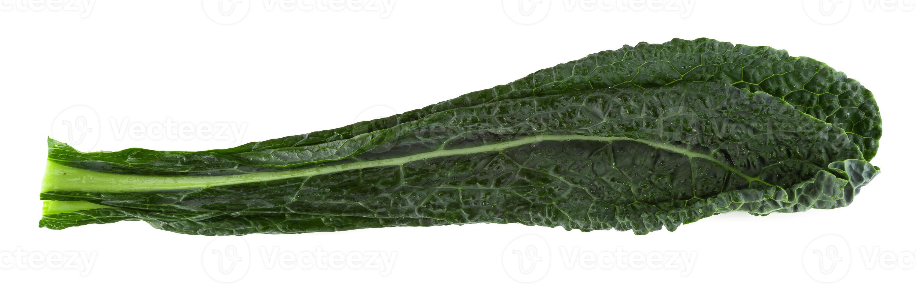 Fresh organic green kale leaves isolated over white background photo