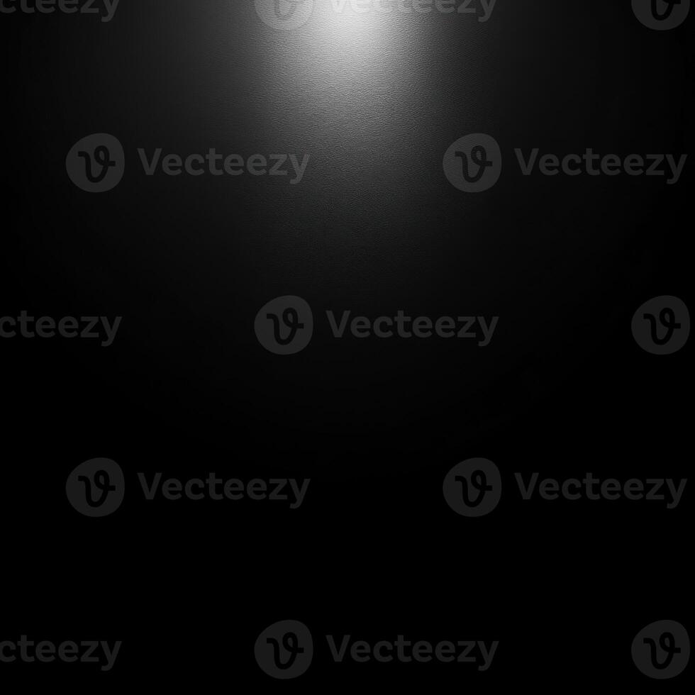 A Single Light Source Illuminating a Dark Textured Surface photo