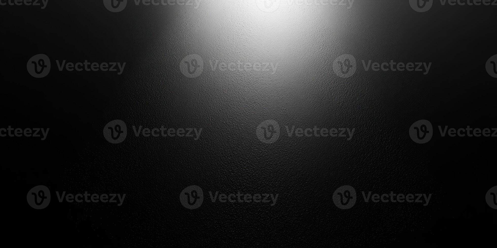 A Single Beam of Light on a Textured Black Surface photo