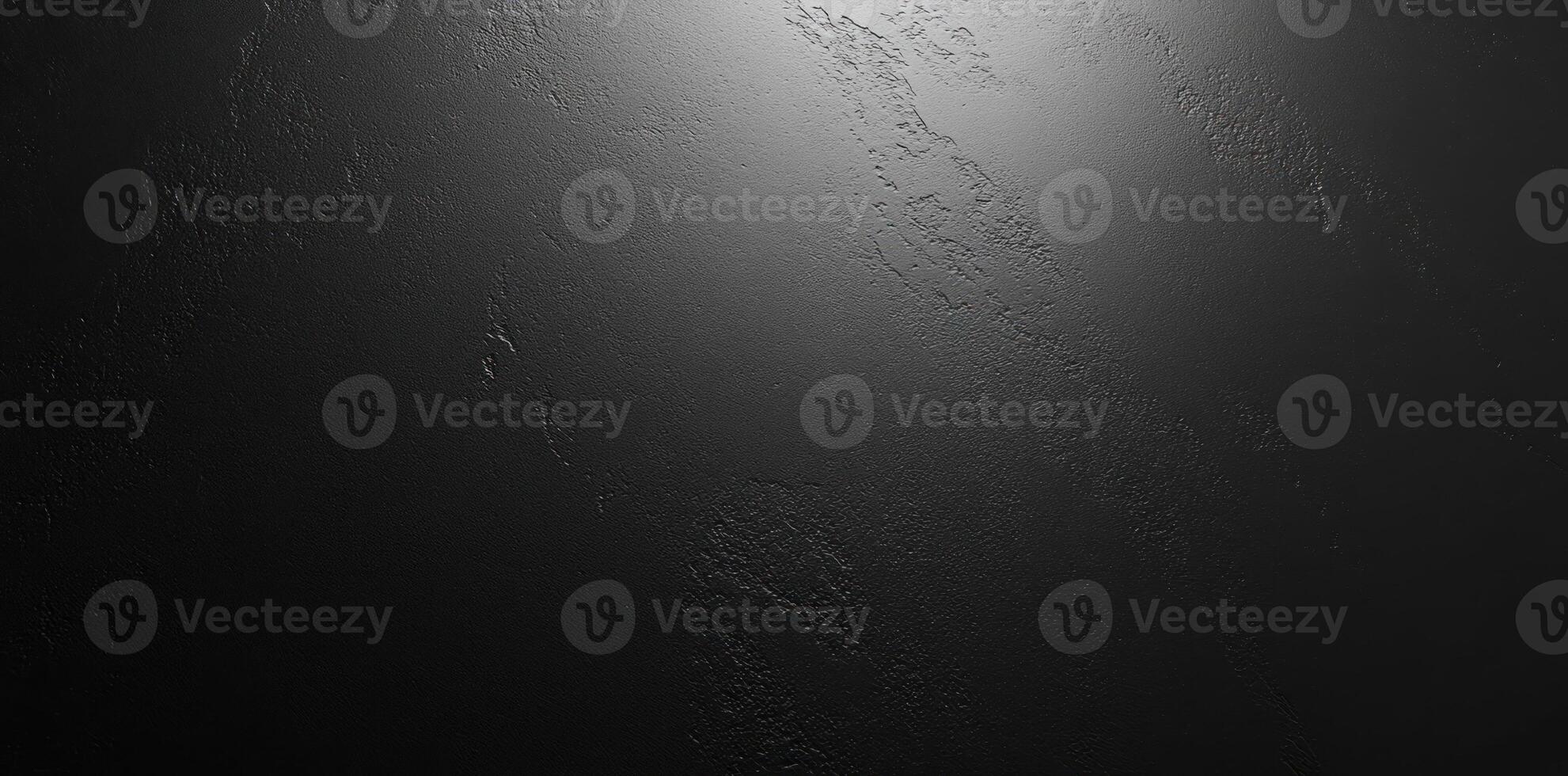 A Close-Up of a Dark, Textured Surface with a Subtle Light Source photo