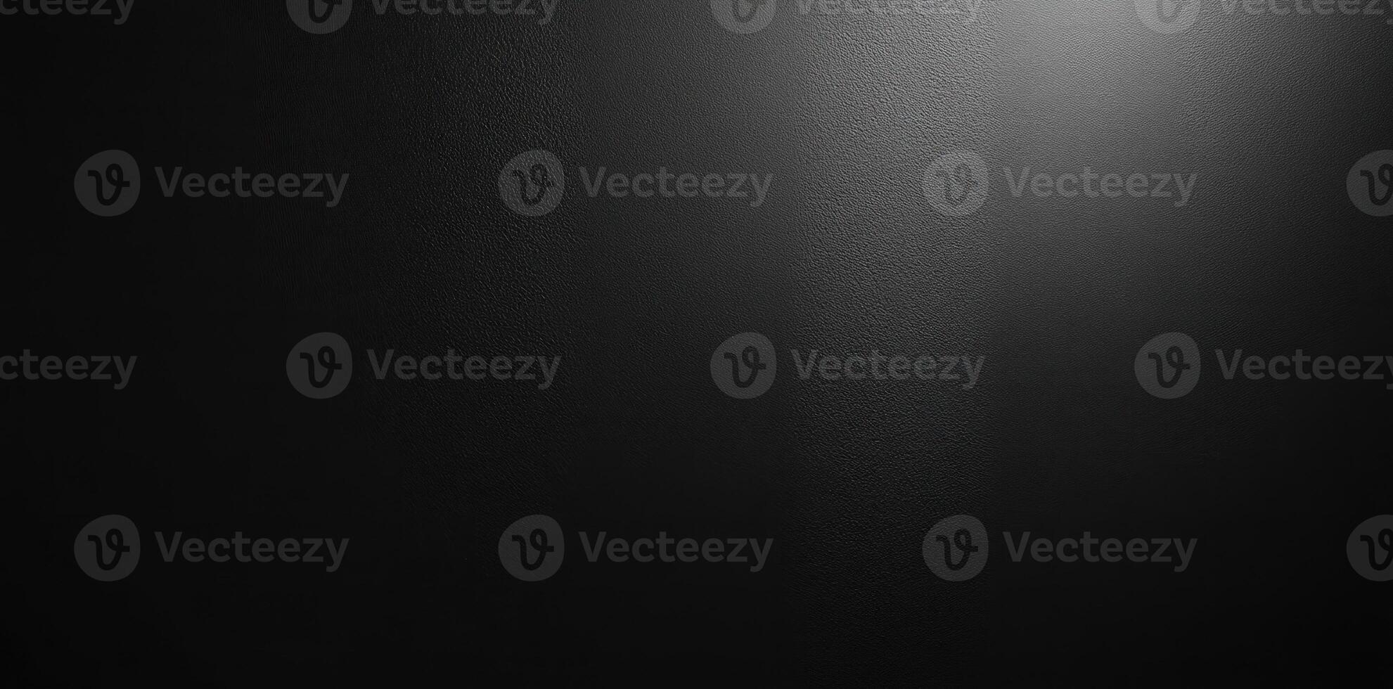 Textured Black Surface Illuminated by a Single Light Source photo