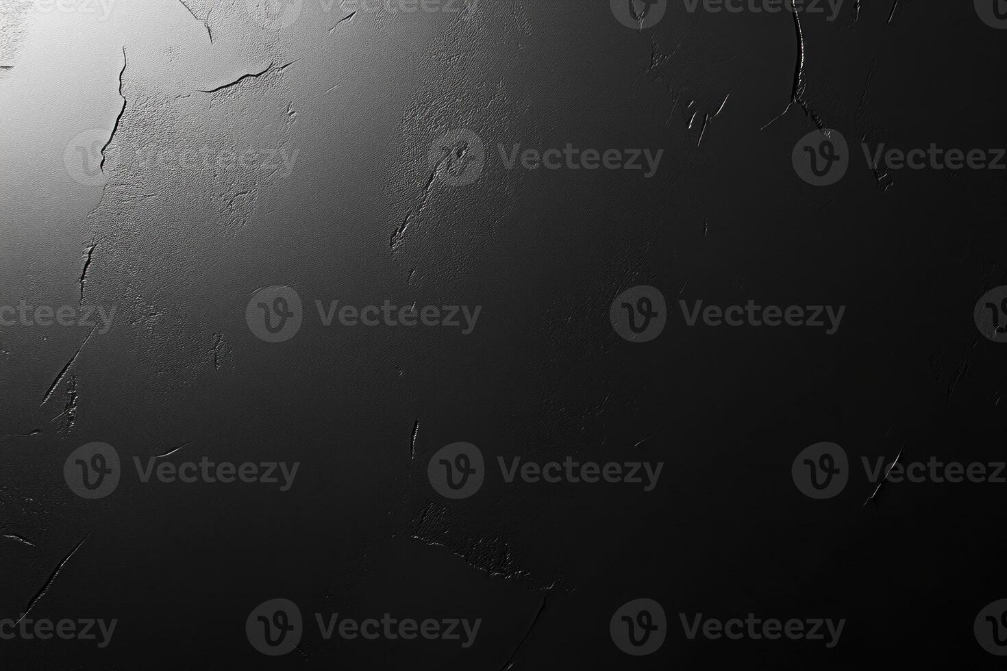 Abstract Black Textured Surface with Cracks and Light photo