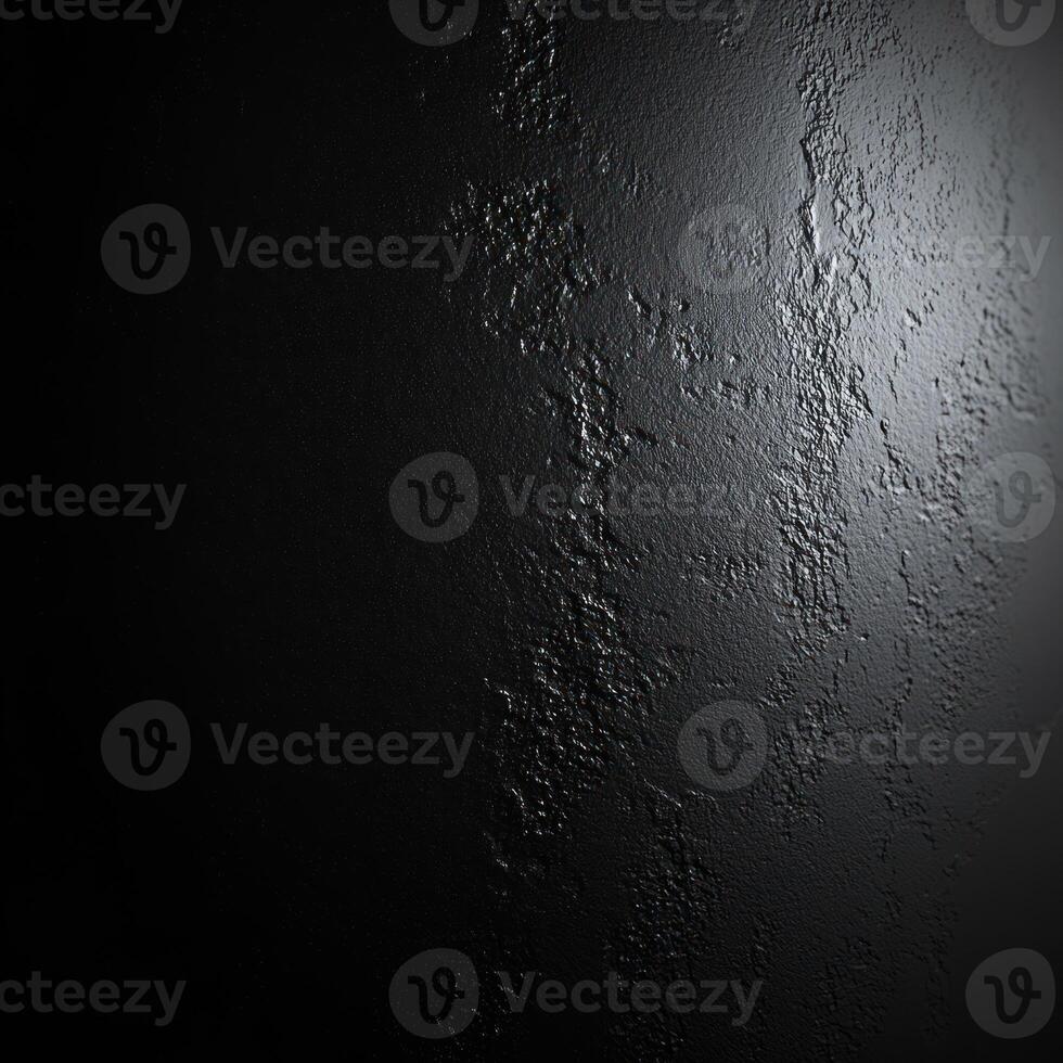 Close-up of Dark Textured Surface with Subtle Light Reflection photo