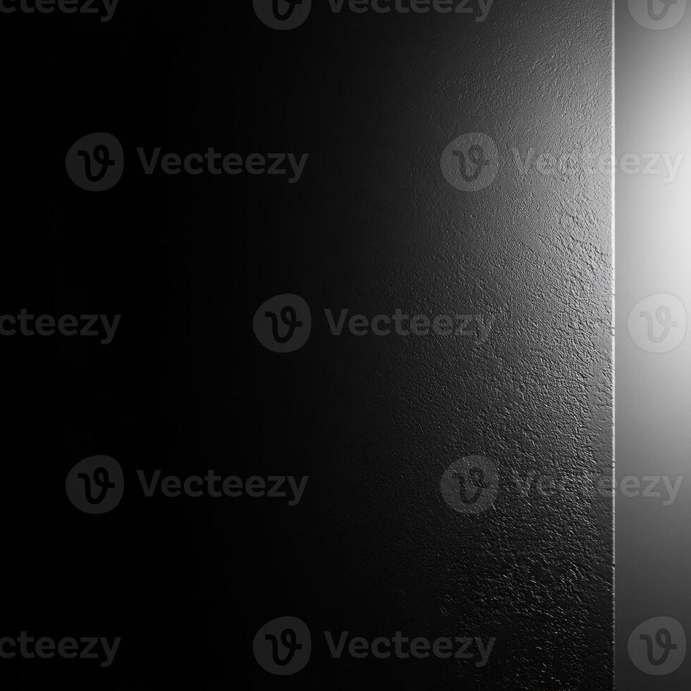 Black Textured Surface with a Light Source on the Right photo