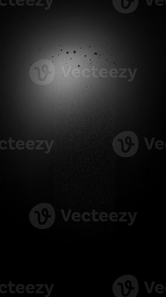 A Vertical Column of Tiny White Spots on a Black Background photo