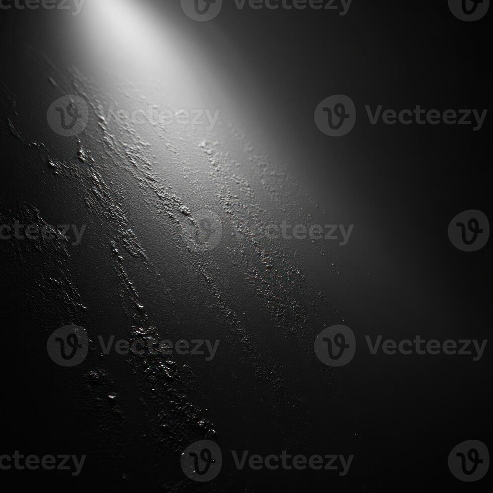 A Single Light Source Illuminates a Textured Dark Surface photo