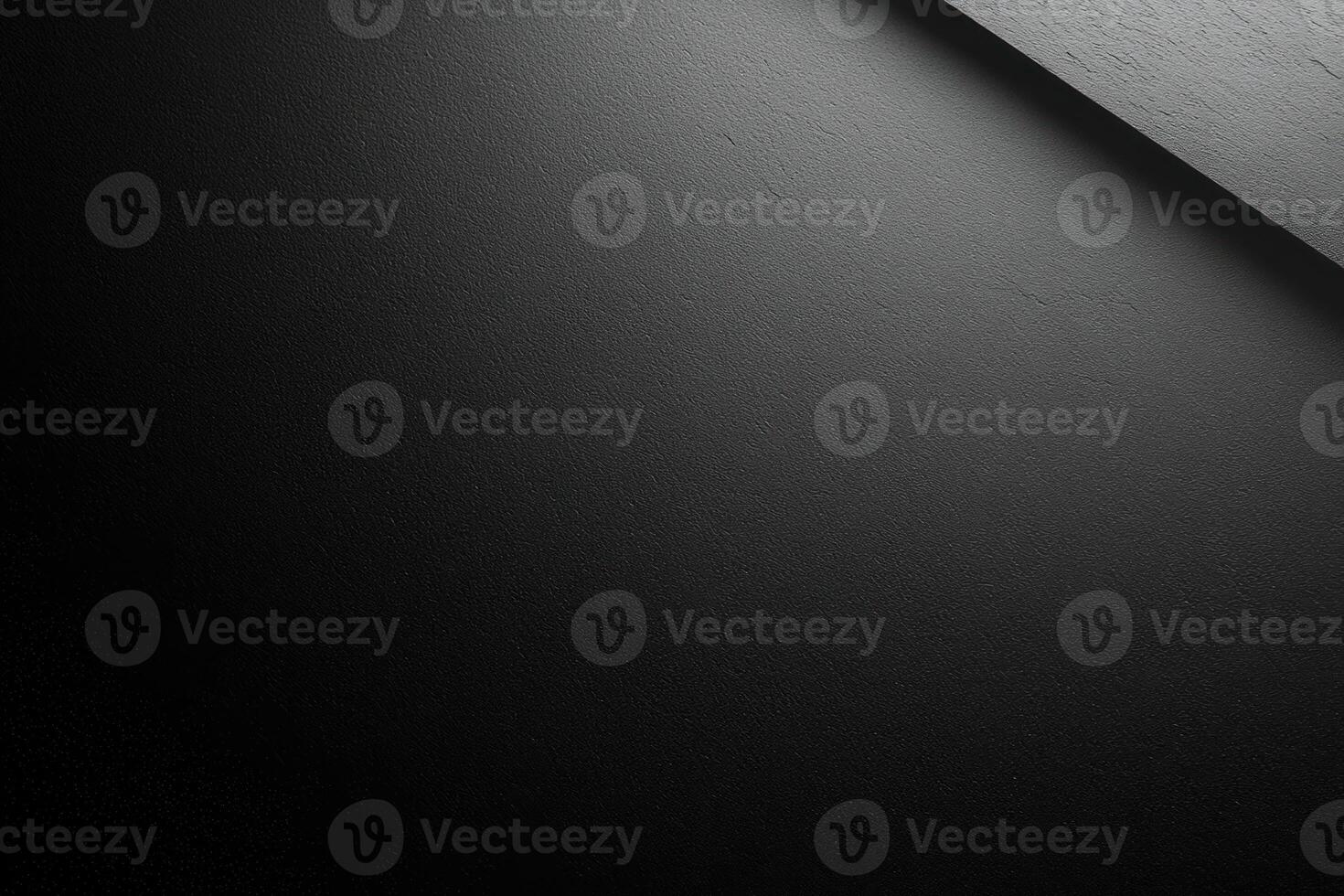 Black Textured Surface with Diagonal Shadow photo