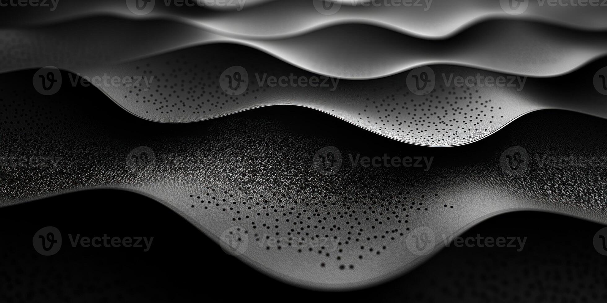 Black Textured Surface with Wavy Pattern and Perforations photo