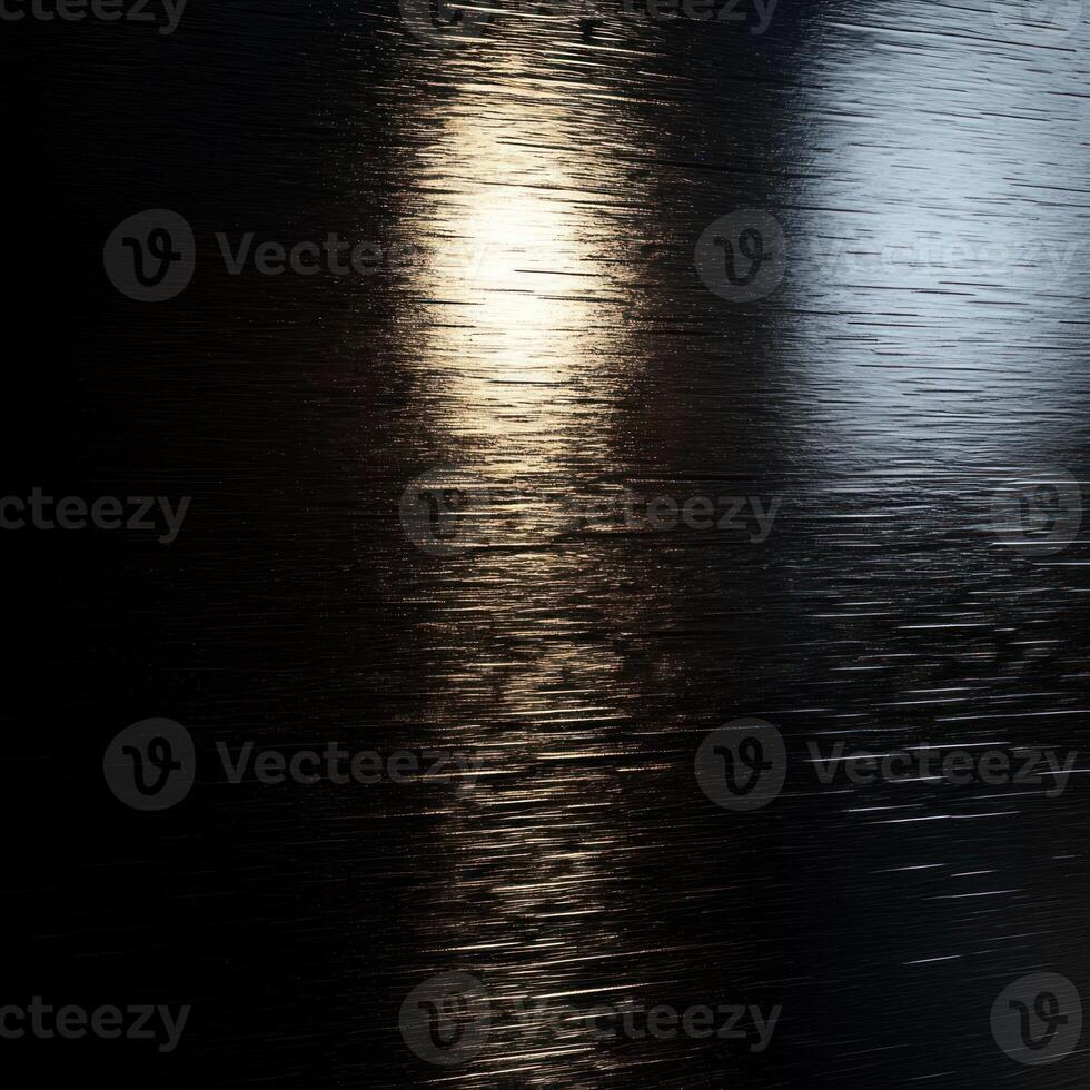 Light Reflecting on a Dark, Textured Surface photo