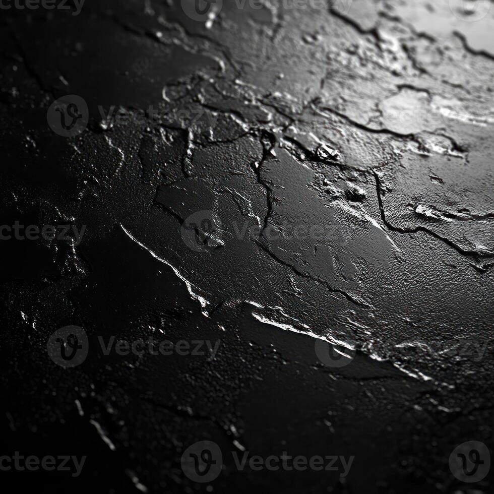 Close-up of a Black, Cracked and Textured Surface photo