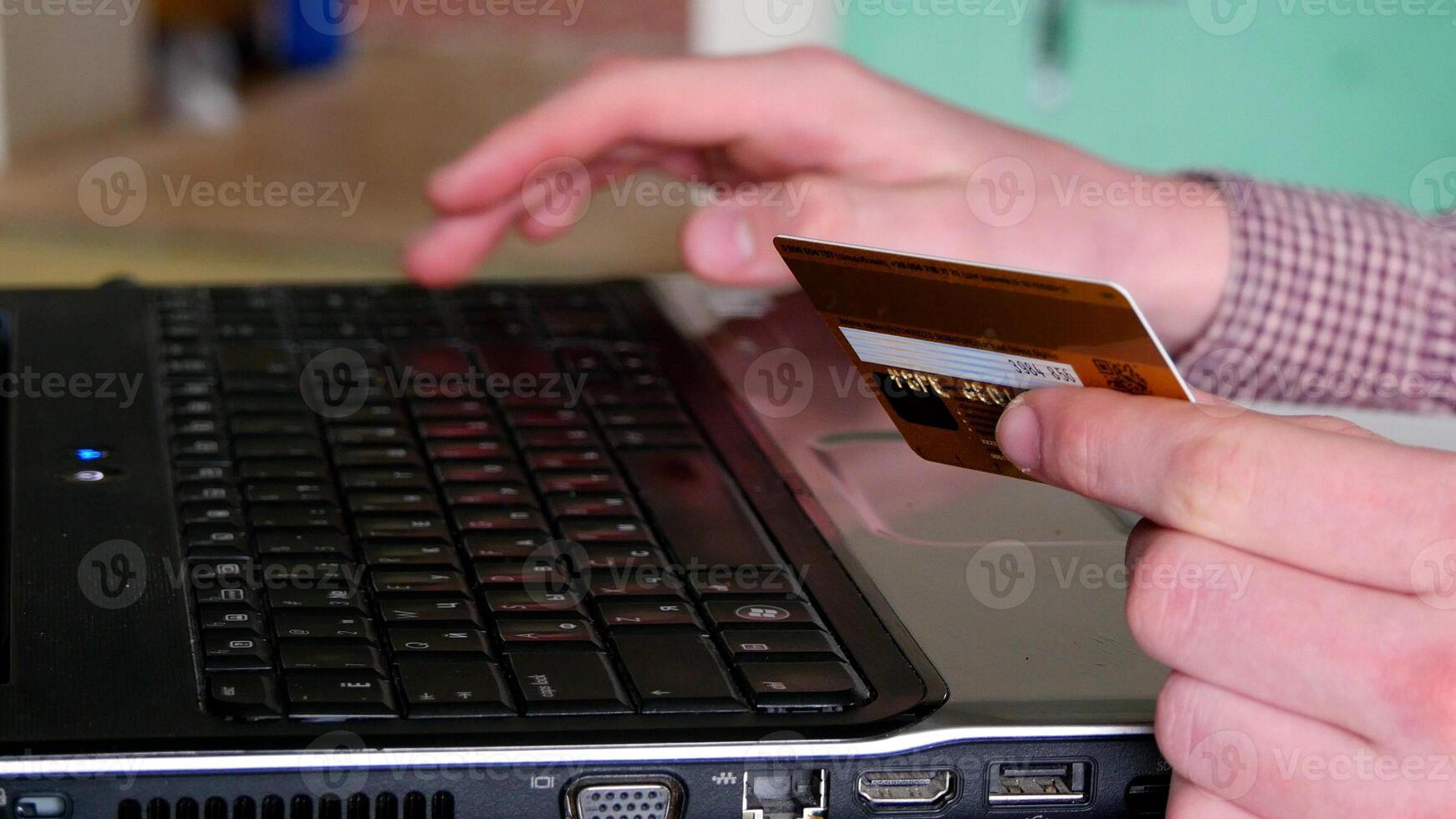 Male arms hold credit card press buttons making transfer closeup. Anti-fraud financial security when entering client discount program number or filling personal credential password login to account photo