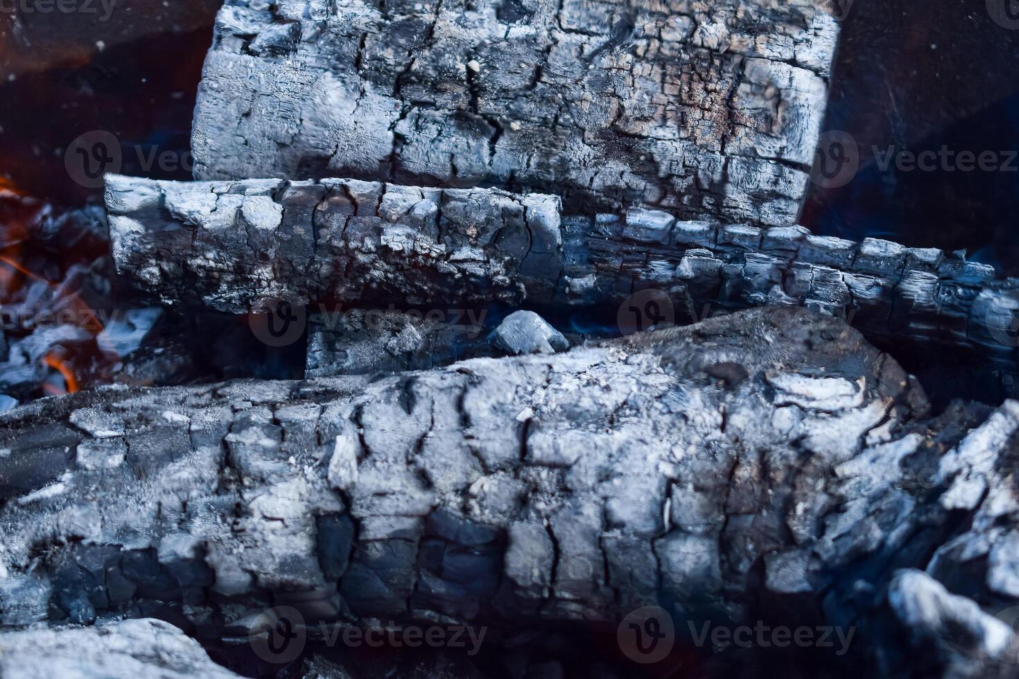 Firewood burning in the brazier, smoldering log coals photo