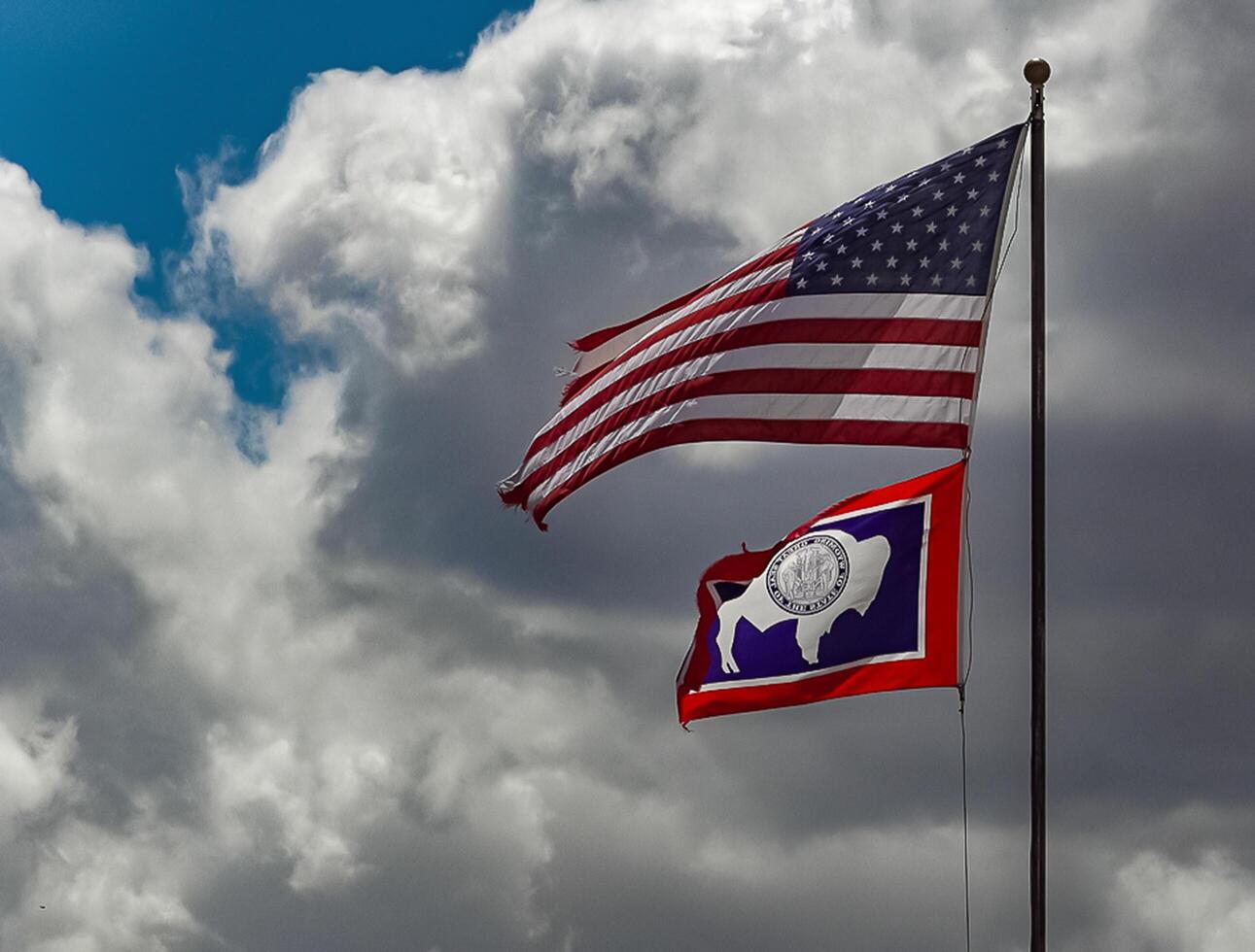 USA, Wyoming - 06 MAY 2018 - Flag of United States and Wyoming State, US photo