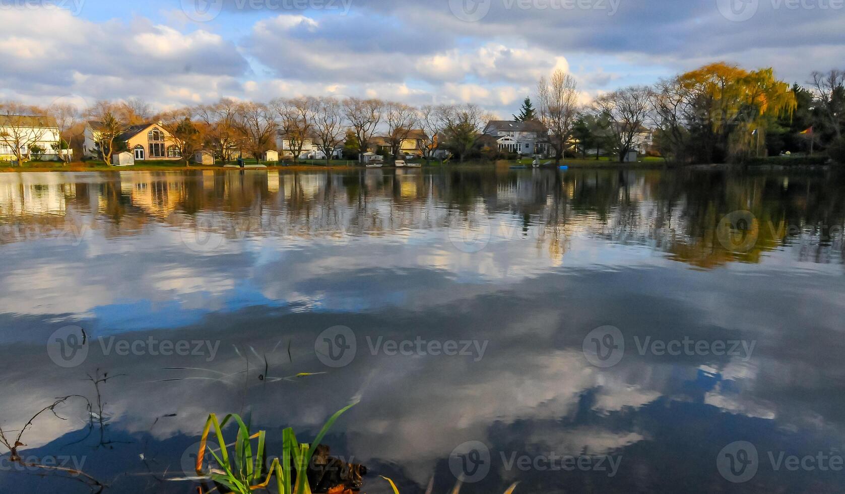 Natural Landscape, Reflection of clouds and lodges in the water of a quiet lake in New Jersey photo