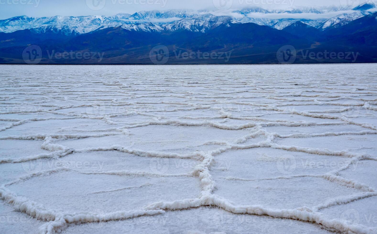 Death Valley National Park, Salt with clay, California. Smooth salt valley with cracked and swollen salt, dead salt landscape photo