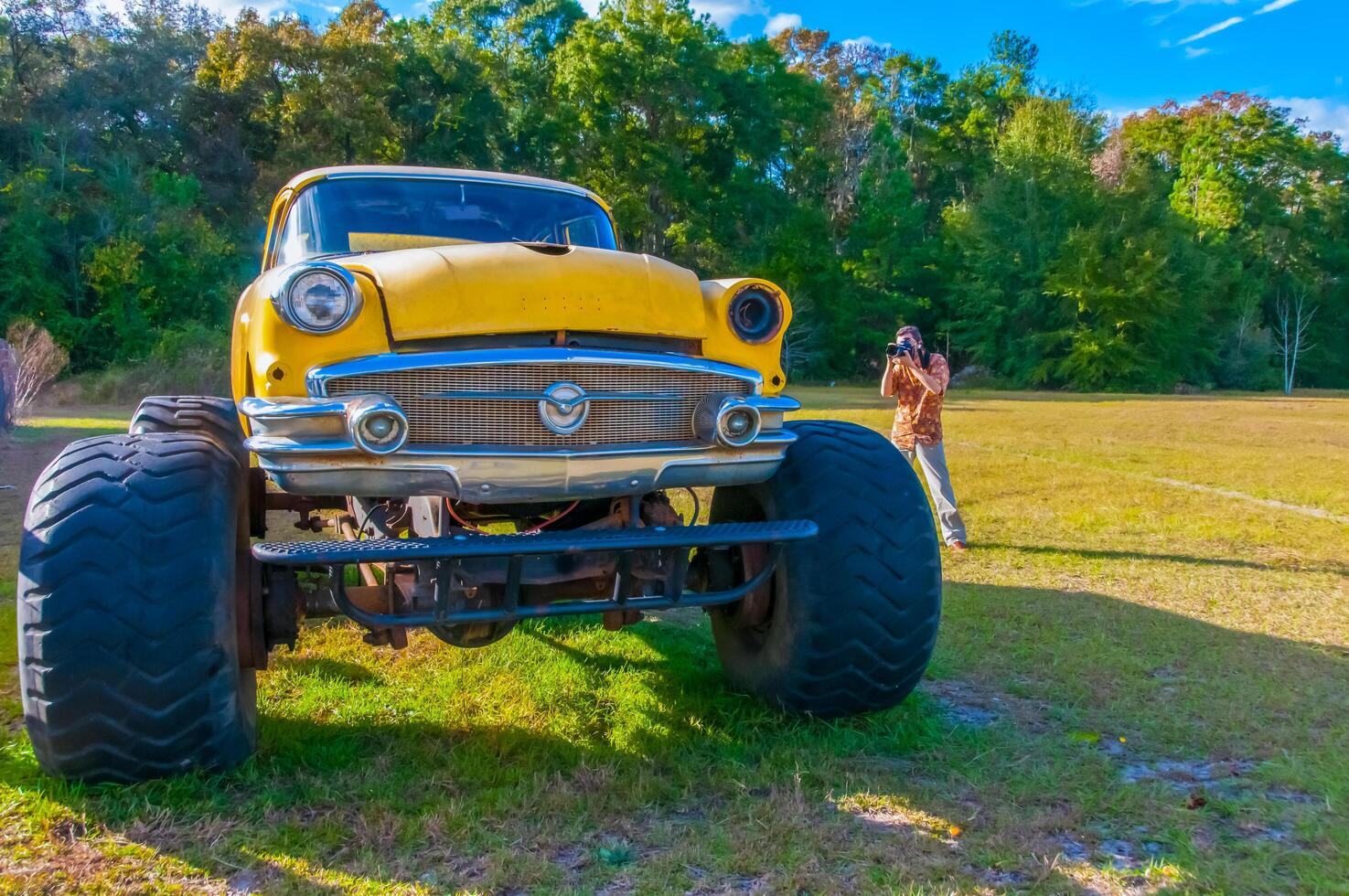 NEW ORLEANS, LOUISIANA - NOVEMBER 27, 2011 Vintage car Buick -1956- with big wheels on a field with green grass photo