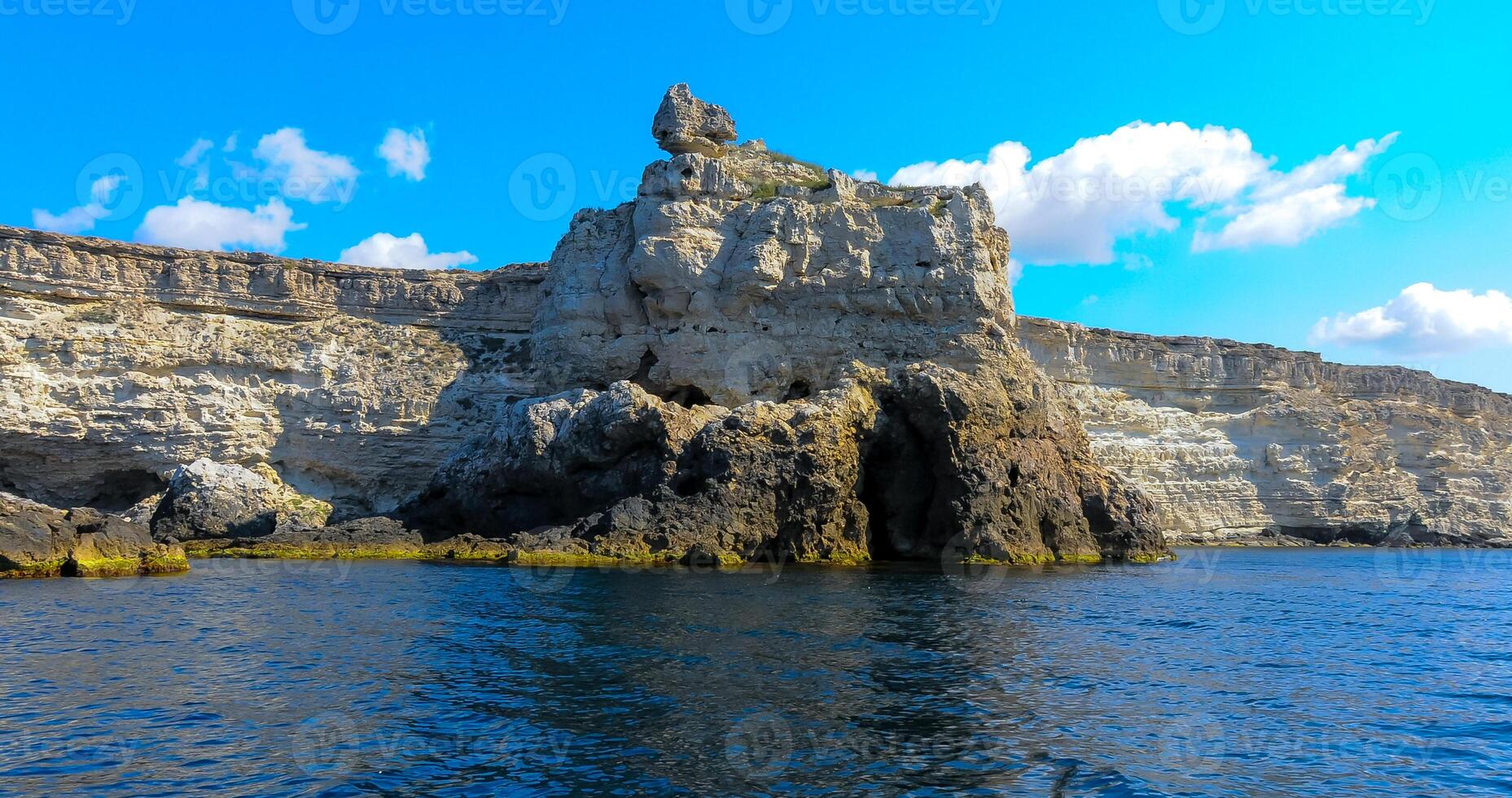 High Coastal cliffs from layered Pontic limestone in the western Crimea, Tarkhankut photo