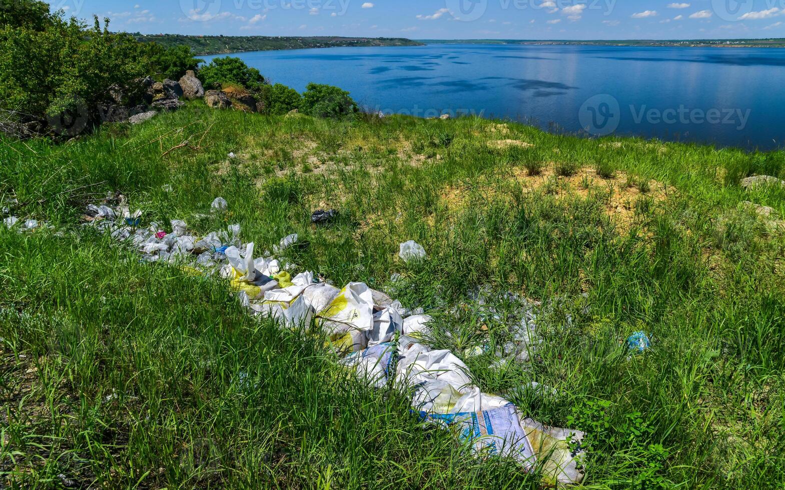 Environmental problem, pollution of the shores of a reservoir with construction and plastic waste, Khadzhibey estuary photo