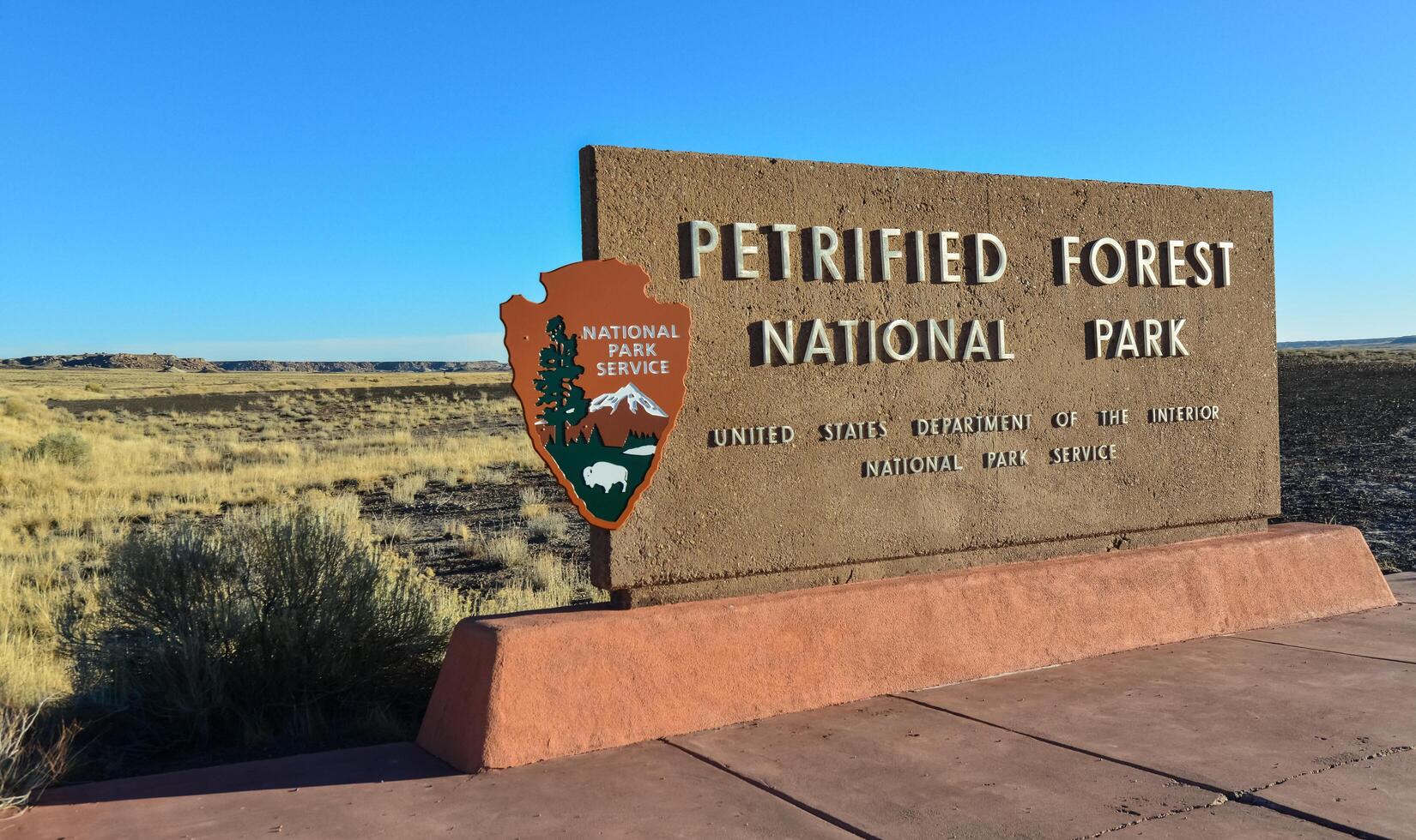 USA, PHENIX, ARIZONA- NOVEMBER 17, 2019 information sign with the name of the park Petrified Forest National Park, Arizona photo