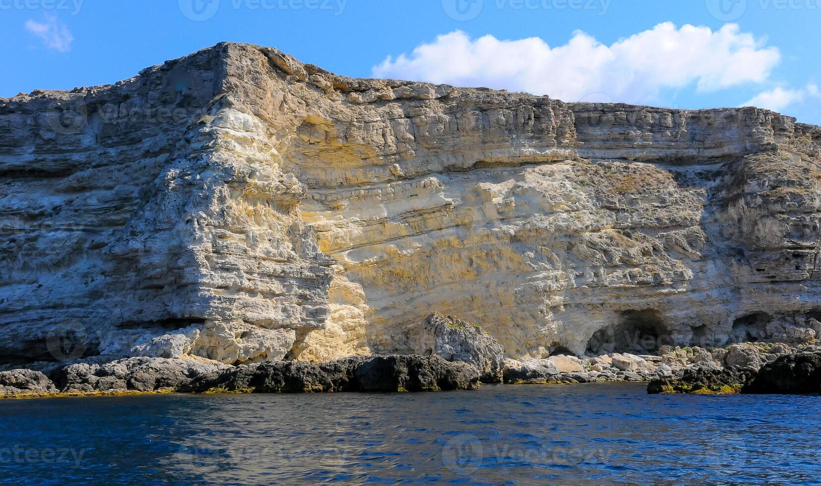 High Coastal cliffs from layered Pontic limestone in the western Crimea, Tarkhankut photo