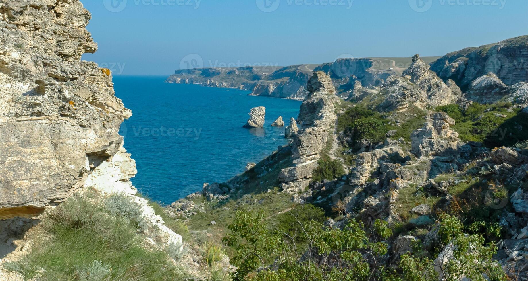 View of the steep banks and rocks in the water in the Dzhangul tract, western Crimea photo