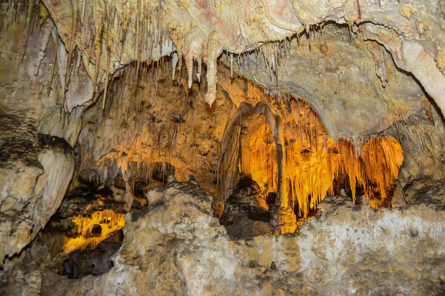 Calcite inlets, stalactites and stalagmites in large underground halls in Carlsbad Caverns National Park, New Mexico. USA photo