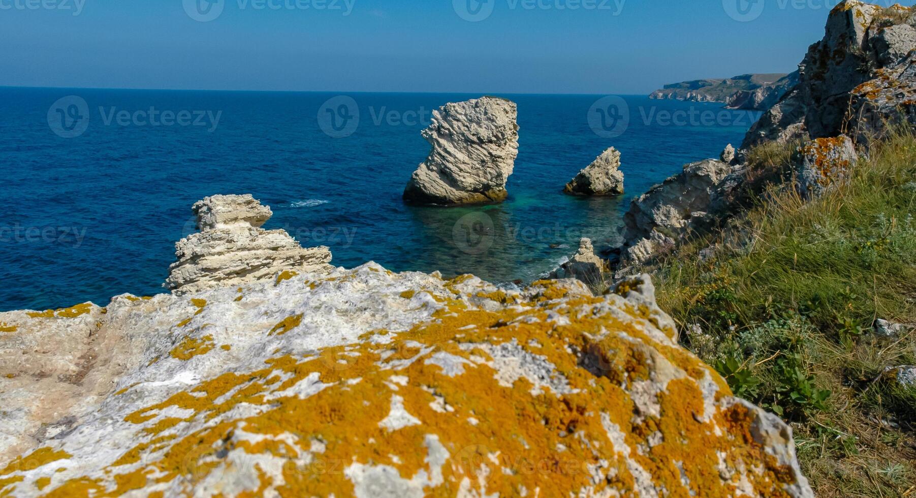 View of the steep banks and rocks in the water in the Dzhangul tract, western Crimea photo