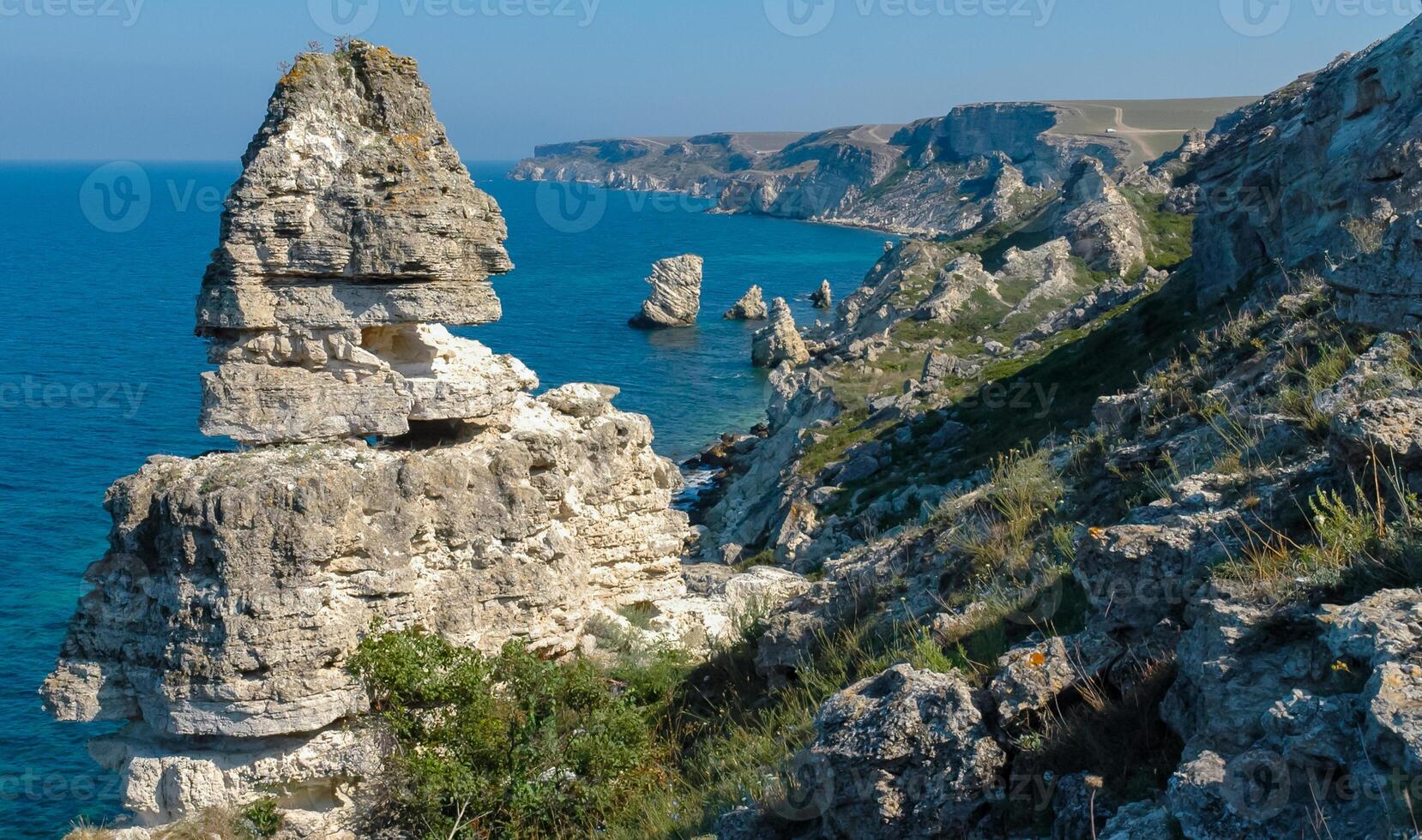 View of the steep banks and rocks in the water in the Dzhangul tract, western Crimea photo