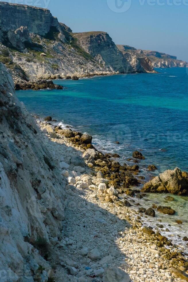 View of the steep banks and rocks in the water in the Dzhangul tract, western Crimea photo