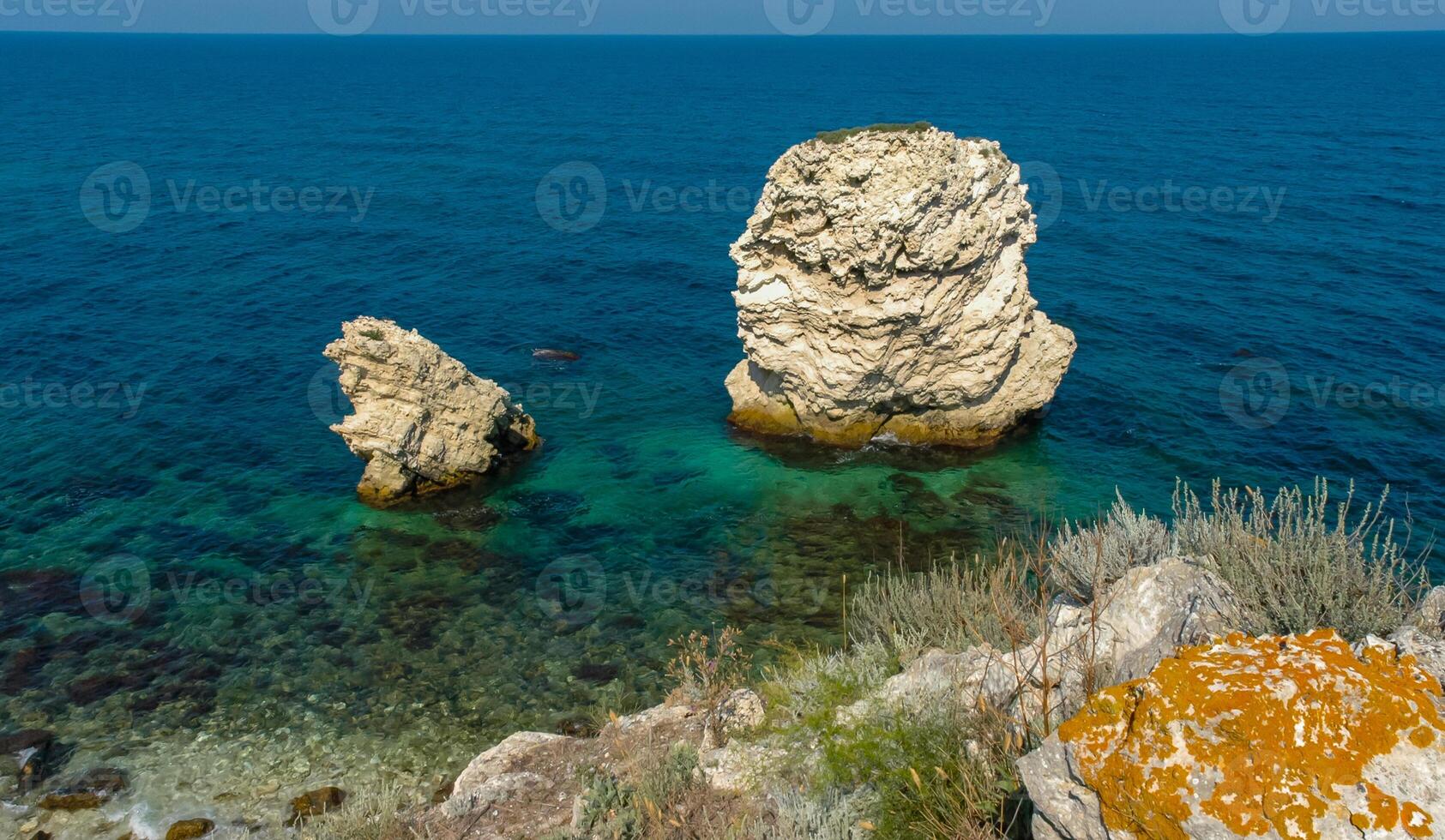 Rocks and islands in the water of the Black Sea near the landslide coast of Dzhangul in the western Crimea, Tarkhankut photo