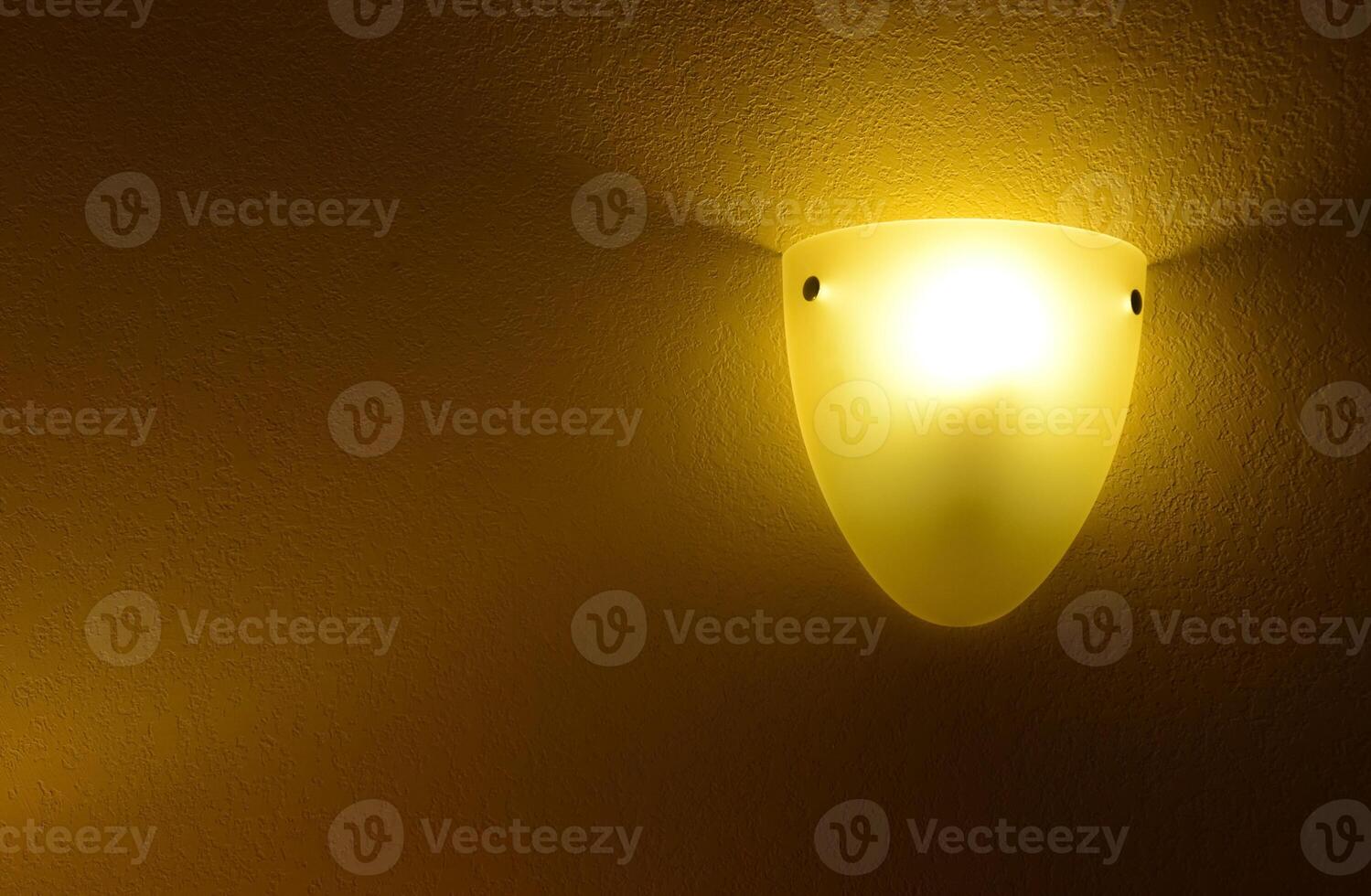 Lamp with yellow light in the corner of the room, room design photo