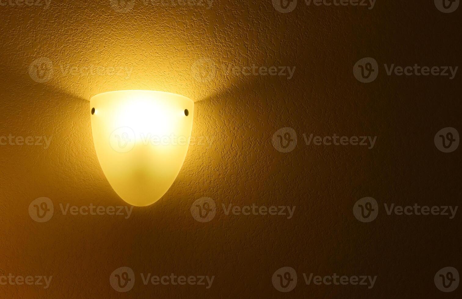Lamp with yellow light in the corner of the room, room design photo