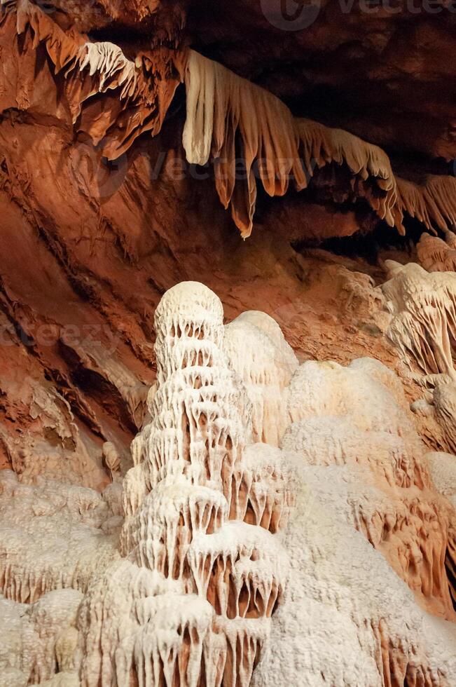 Calcite inlets, stalactites and stalagmites in large underground halls in Carlsbad Caverns NP, New Mexico photo