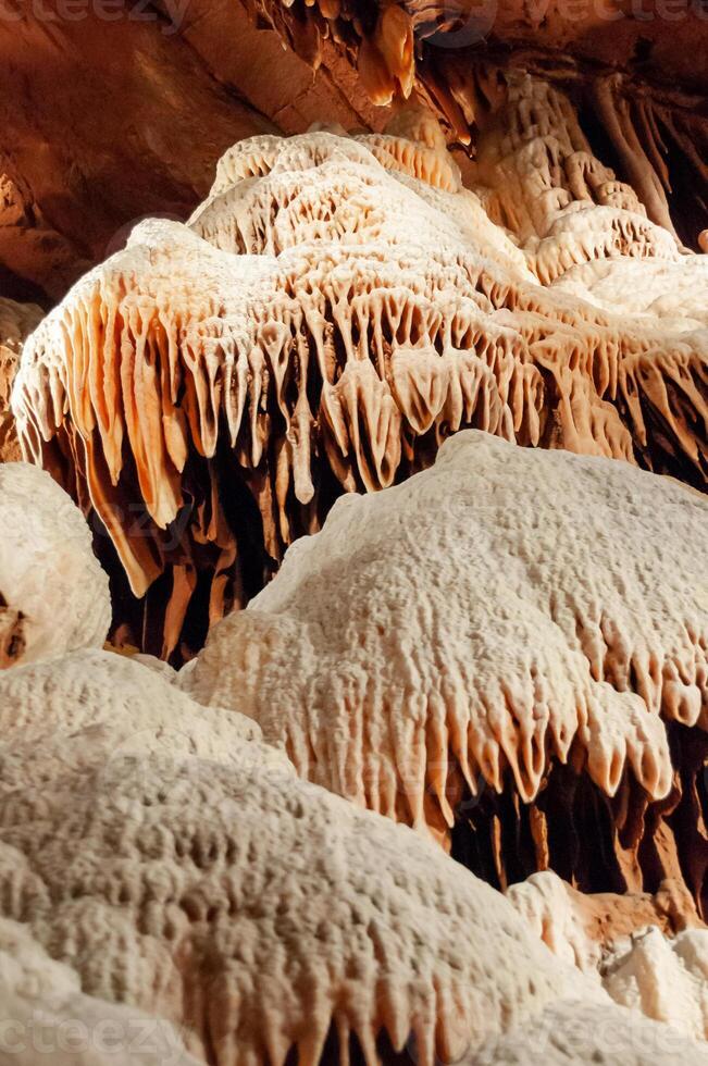 Calcite inlets, stalactites and stalagmites in large underground halls in Carlsbad Caverns NP, New Mexico photo