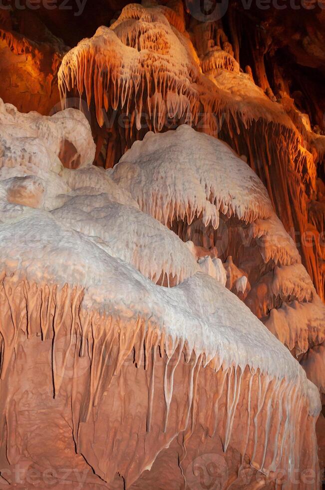 Calcite inlets, stalactites and stalagmites in large underground halls in Carlsbad Caverns NP, New Mexico photo