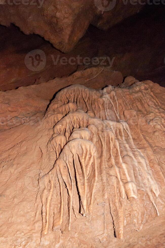 Calcite inlets, stalactites and stalagmites in large underground halls in Carlsbad Caverns NP, New Mexico photo